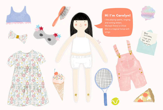 Carolyn the paper doll center stage with outfits and accessories scattered around for dress up.