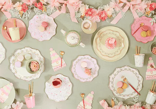 3 images go by on rotation; a table laid with pastel plates and floral garlands and macaroons, another laid with pink flowers and retro and rollerskate plates, and a final table decorated with tennis ball plates and racket napkins.
