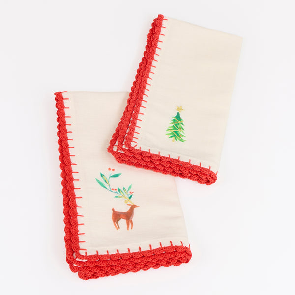 Our Christmas fabric napkins are made from an ivory linen and cotton blend, with festive motifs, embroidered details and crochet borders. Image6