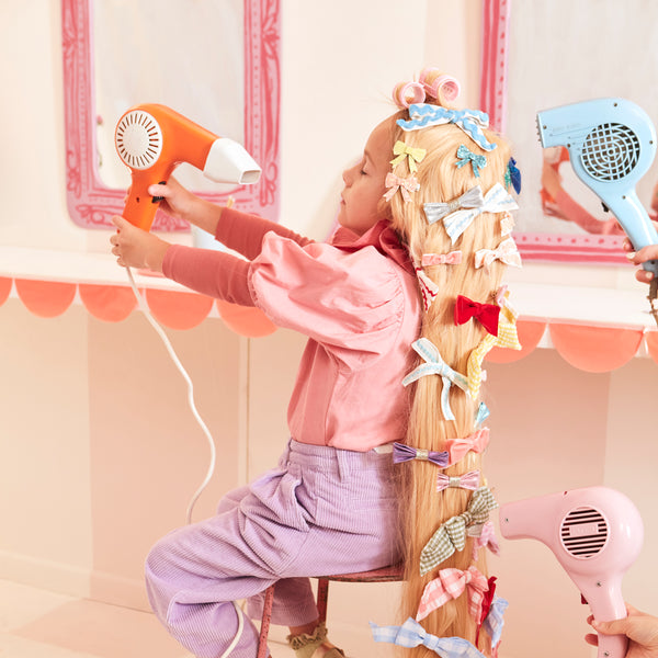 Our bow hair clips feature on-trend ric rac in pretty colours, fabulous as kids accessories. Image2