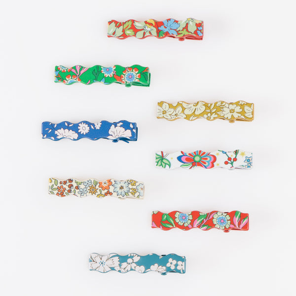 Our Christmas hair clips feature 8 different Liberty floral print designs and an elegant wavy shape, perfect to elevate your festive hair styles. Image2