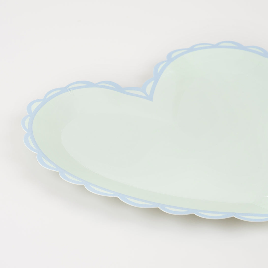 Our small plates, in heart shapes, feature a range of pretty pastel colours and a scalloped border.