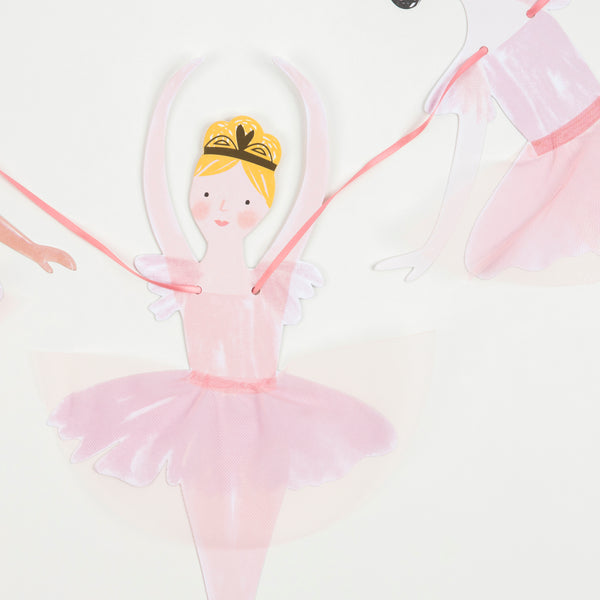 This set includes ballerina decorations for a birthday party, and tableware and a cupcake kit.  Image3