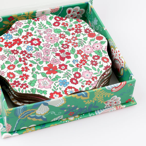 Our Christmas coasters, made from a laminated wood composite, feature elegant Liberty print designs, perfect as a host gift. Image6