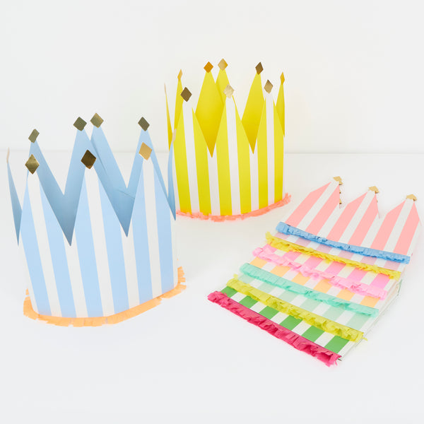 Our paper crowns, made with vibrant stripes, tissue paper fringing and shiny gold foil details, are the perfect birthday party hats. Image1