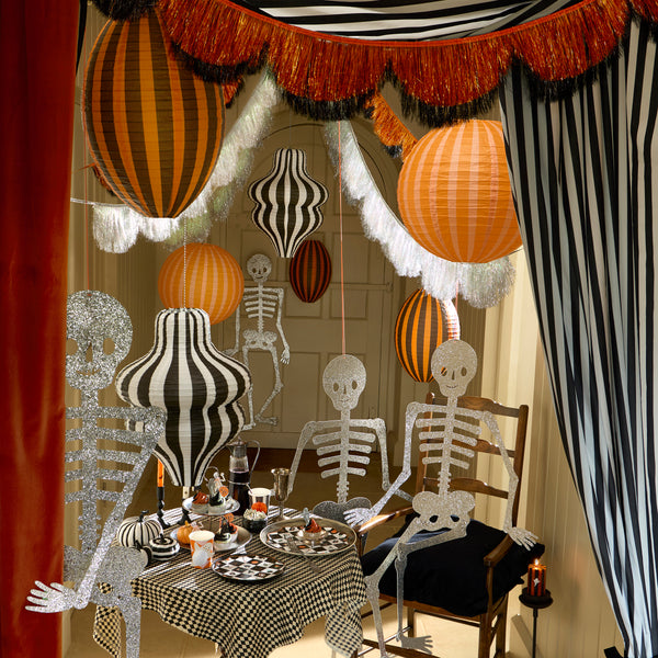 Our Halloween lanterns, made with paper over wire, feature bright stripes in classic Halloween colours for a bold decorative look. Image2
