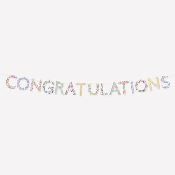 Our special paper garland spells out the word Congratulations in scalloped letter pennants with Liberty designs, ideal for any celebration. Image1
