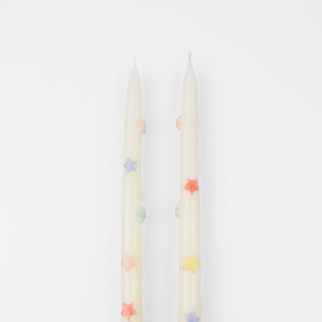 Our taper candles, with coloured stars, will look great as table candles or on placed on the mantel.