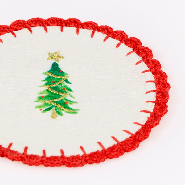 Our fabric cocktail napkins for Christmas are made with a linen and cotton blend, festive motifs, red crochet borders and gold embroidery. Image5