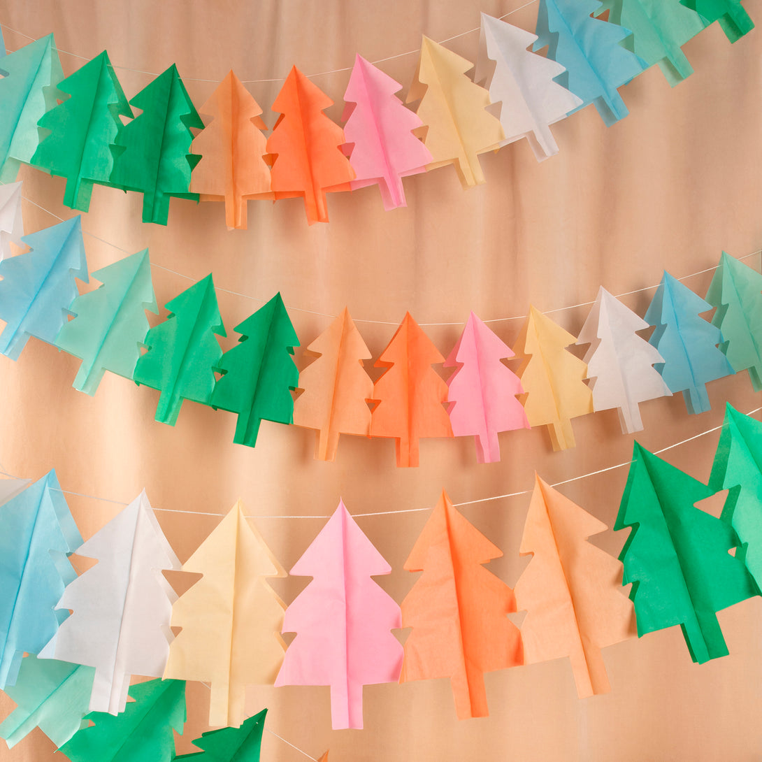 Our hanging Christmas decorations feature tissue paper Christmas trees in lots of colours for a merry and bright look.