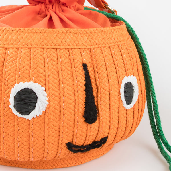 Our Halloween basket has a cute pumpkin face and fun tassels. Image3