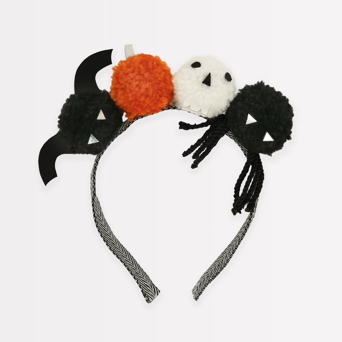 Add our Halloween headband, with fun pom pom details, to your Halloween accessories for a thrilling look.