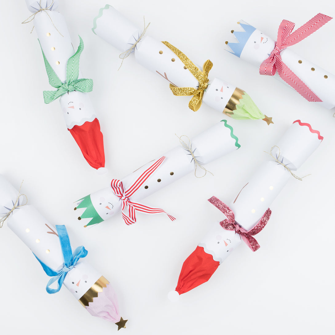 Our fun Christmas crackers have fun snowmen details with hat and scarf embelllishments, and contain fabulous erasers, party hats and jokes.