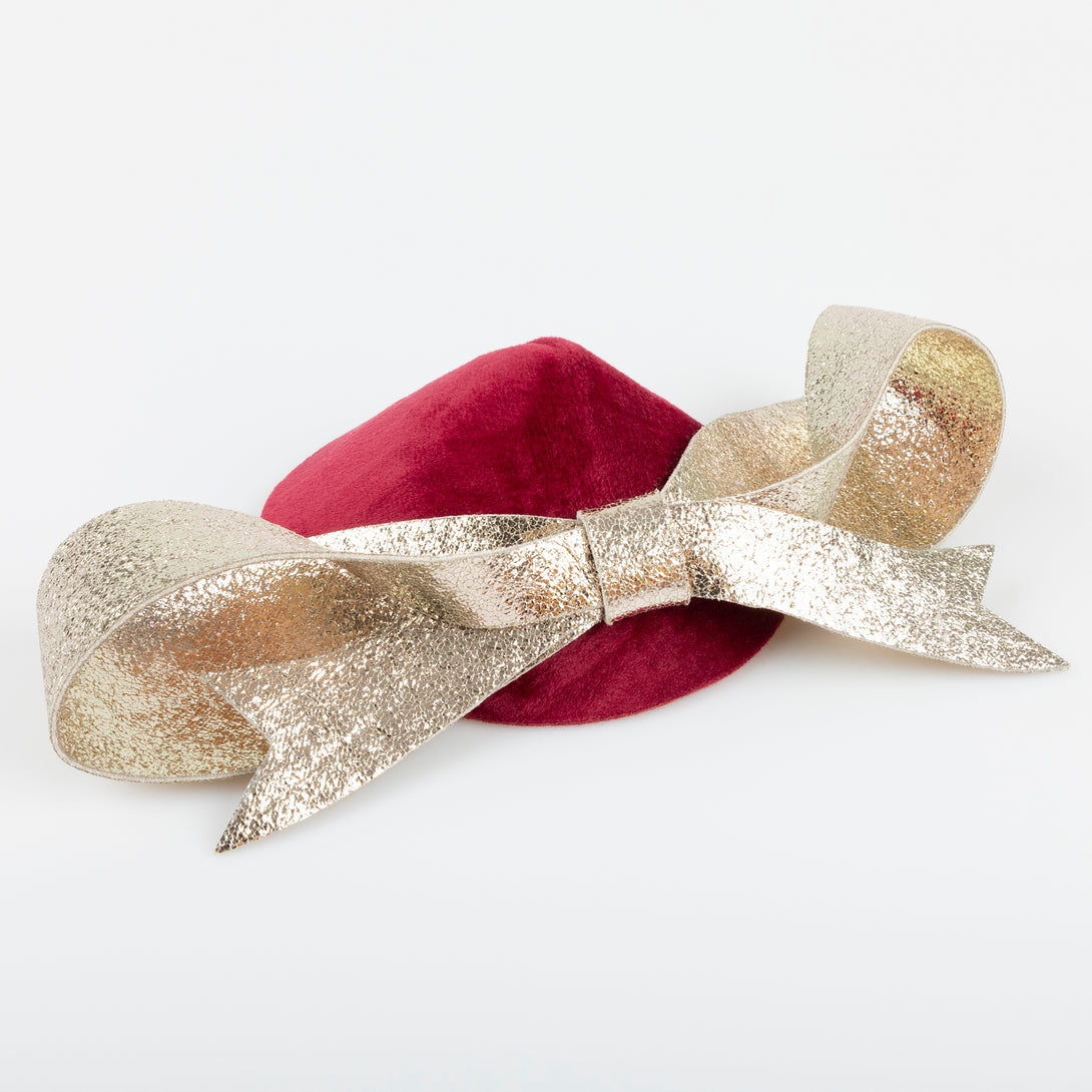 Our Christmas hat and gold faux leather hair clip is the perfect hair accessory for an elegant festive look. Image1