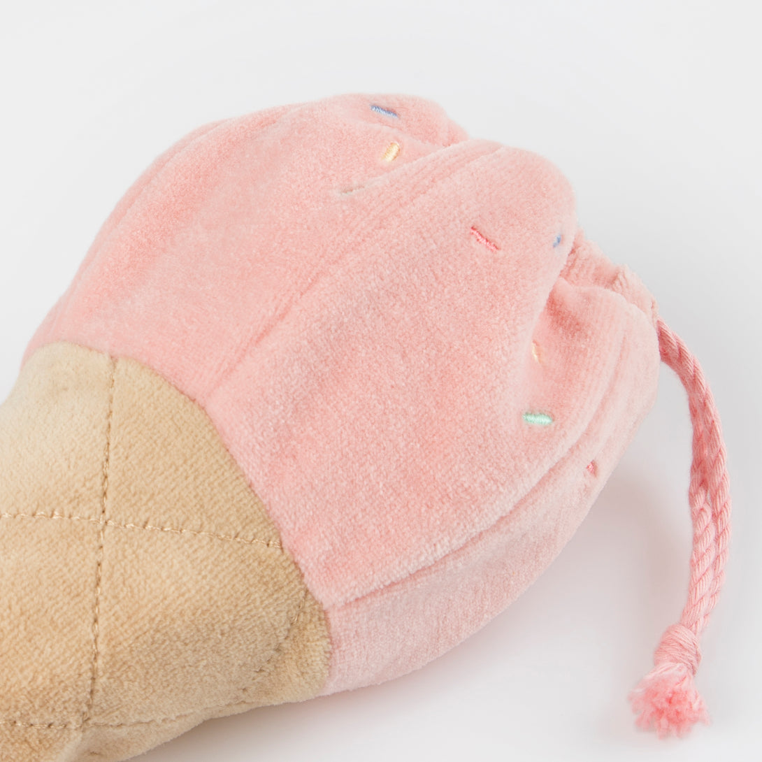 Our fabric doll, a little mouse, has an ice cream pouch for imaginative play.