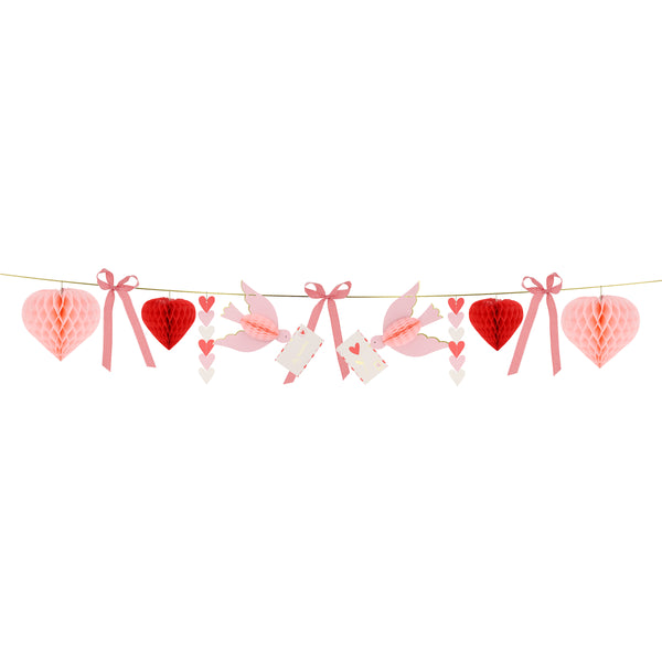 Our Valentine's decoration is a beautiful Valentine's garland with 3D hearts, love birds and gingham bows, all in pretty pink and red tones. Image3