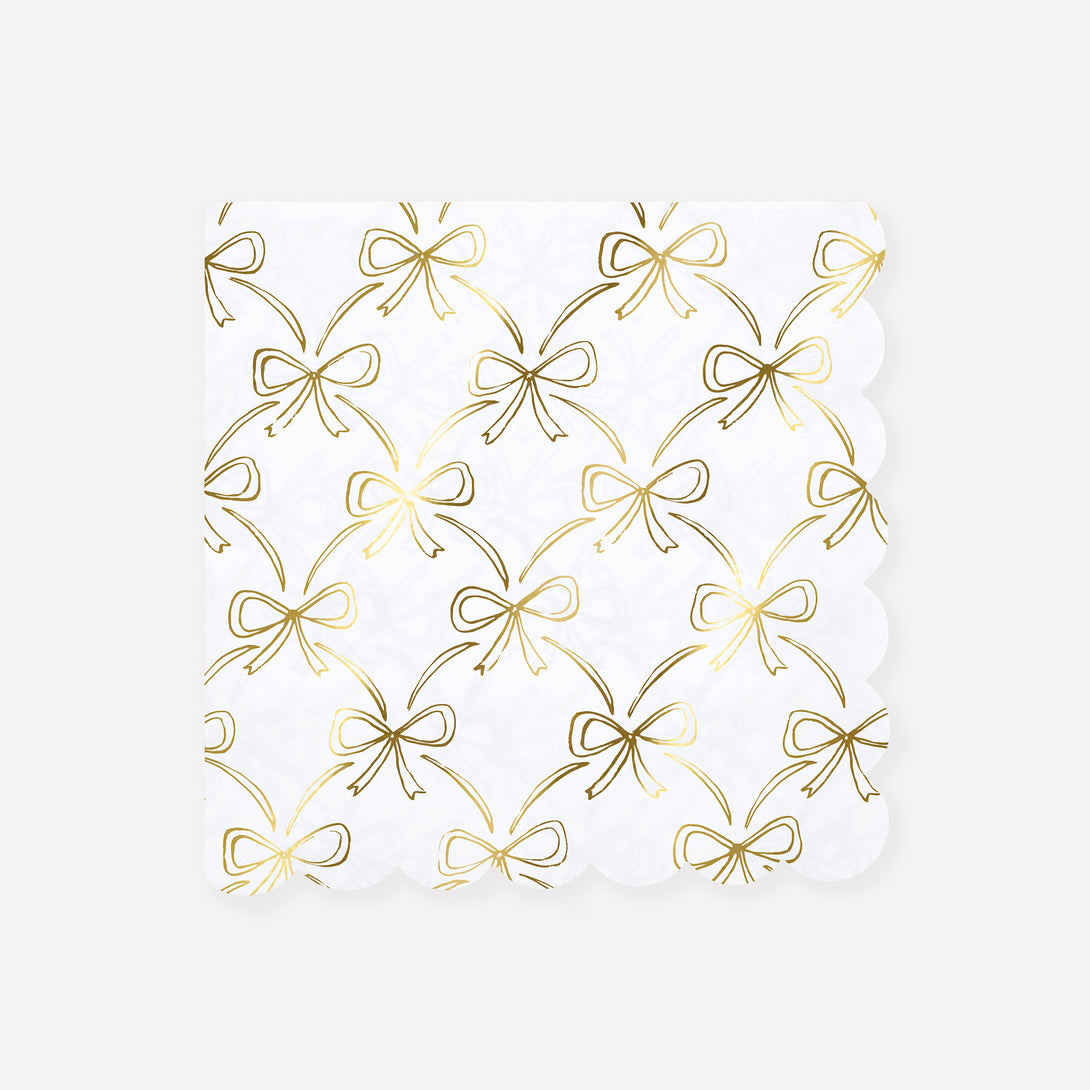 Our Christmas paper napkins have a shiny gold foil bow design to add sophistication to your festive parties. Image1