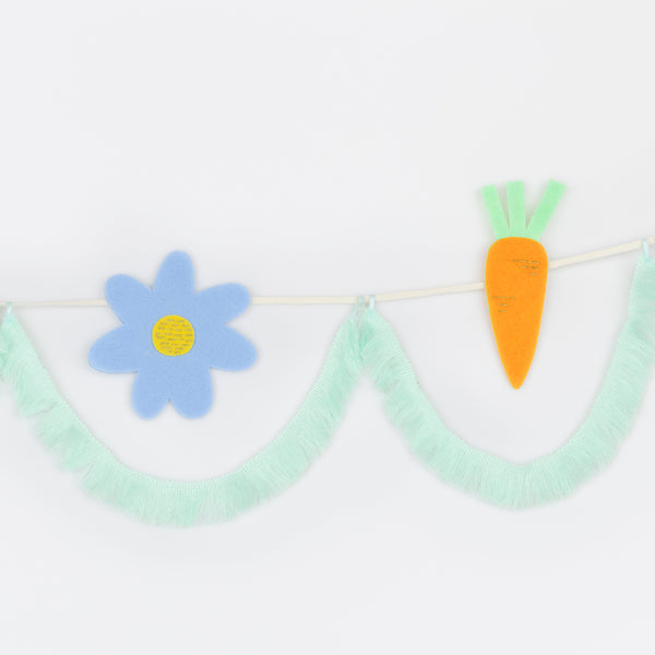 Our fabric garland is perfect to add to your Easter decorations, featuring felt Easter icons and playful tasselled fringe details for fun and style. Image3