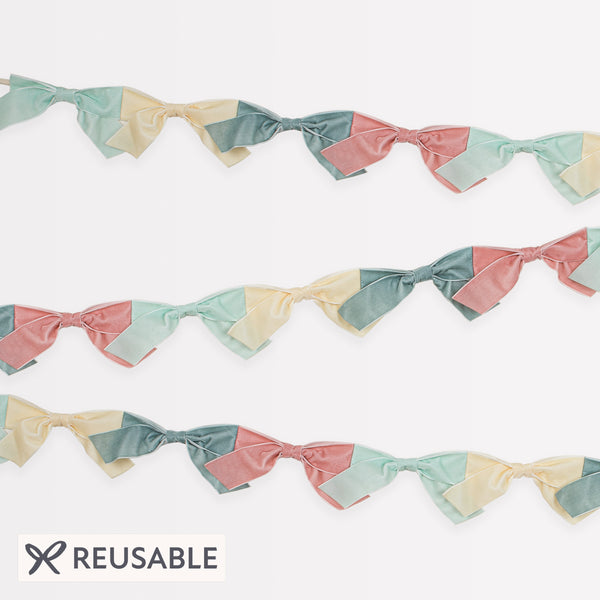 Our velvet bow fabric garland makes a special hanging decoration for a baby shower or bridal shower. Image1