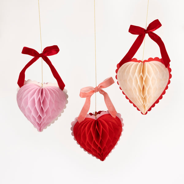 Our Valentine's hanging decorations, 3D honeycomb hearts in pink, red and cream with velvet ribbons, are perfect to set the scene for love Image1