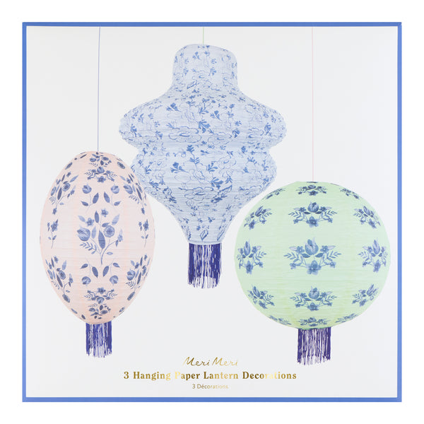 Our paper lanterns set, of three, come in mint, blue and pink, with round, wavy and oval shapes, with blue botanical illustrations and blue tassels. Image8