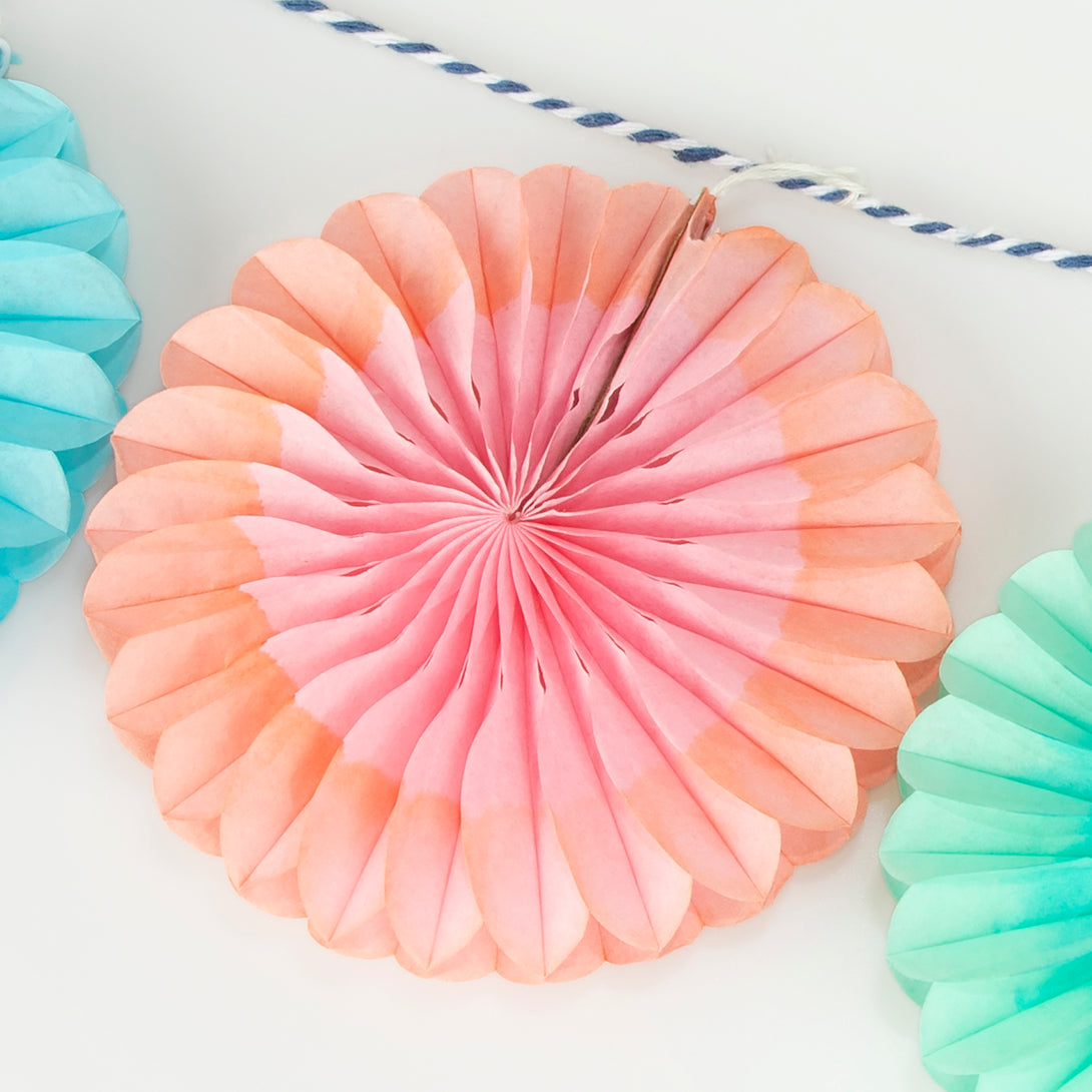 Our mini garland, with colourful honeycomb fans, is perfect to add decorations to any party.