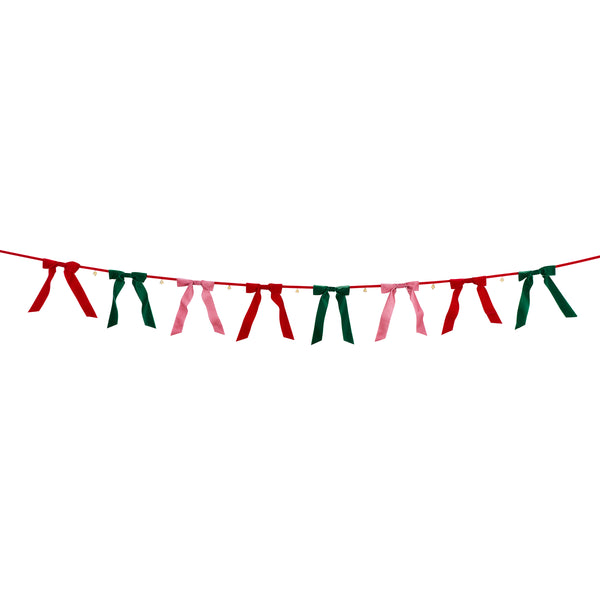 Our Christmas garland features luxurious velvet bows and tinkling bells, hung on a velvet ribbon for an elegant reusable decoration. Image3