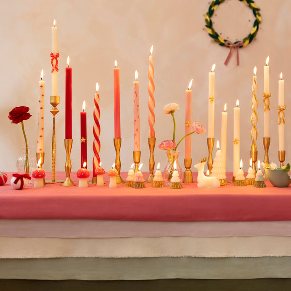 Add a colourful look to your Christmas table with our ivory candles with a stunning twist of red. Image2