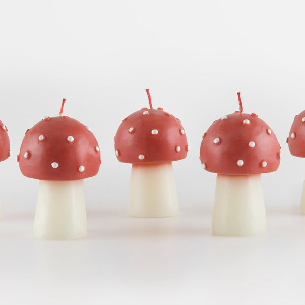 Our Christmas candles, are shaped like little mushrooms, in red and white with red wicks. Image4