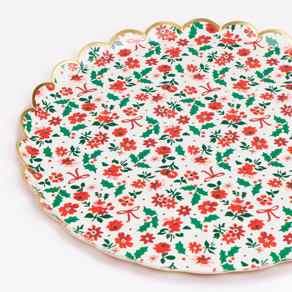 Our Christmas dinner plates, made from paper, feature a beautiful floral ditsy design, with holly and bows, and a scalloped border for style. Image2
