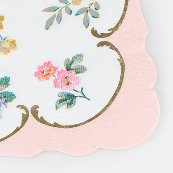Our pink napkins feature shiny gold foil details, pretty posies and a scalloped edge, to add a touch of charm and beauty to any meal. Image2