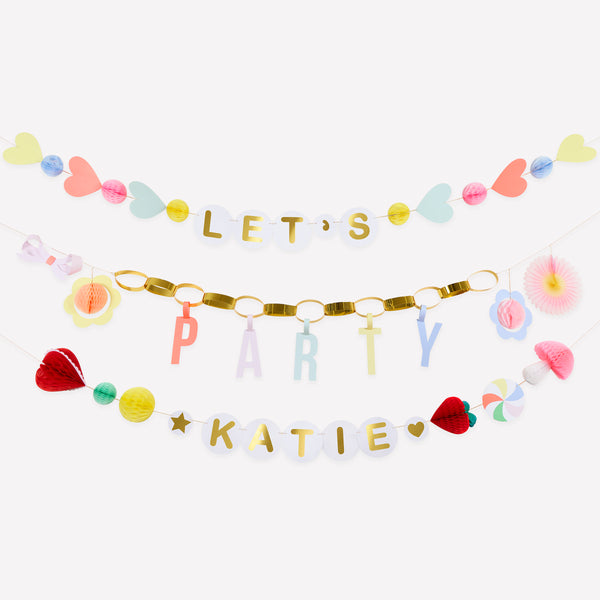 Our party garland features 3 garlands, with a section to personalise the birthday girl or boy's name, perfect to add to your birthday party decor. Image1