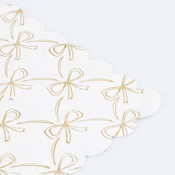 Our Christmas paper napkins have a shiny gold foil bow design to add sophistication to your festive parties. Image2