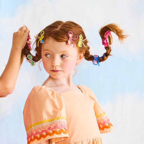 Our bow hair clips are made with pretty beads and velvet-covered clips for a really stylish hair accessory. Image2