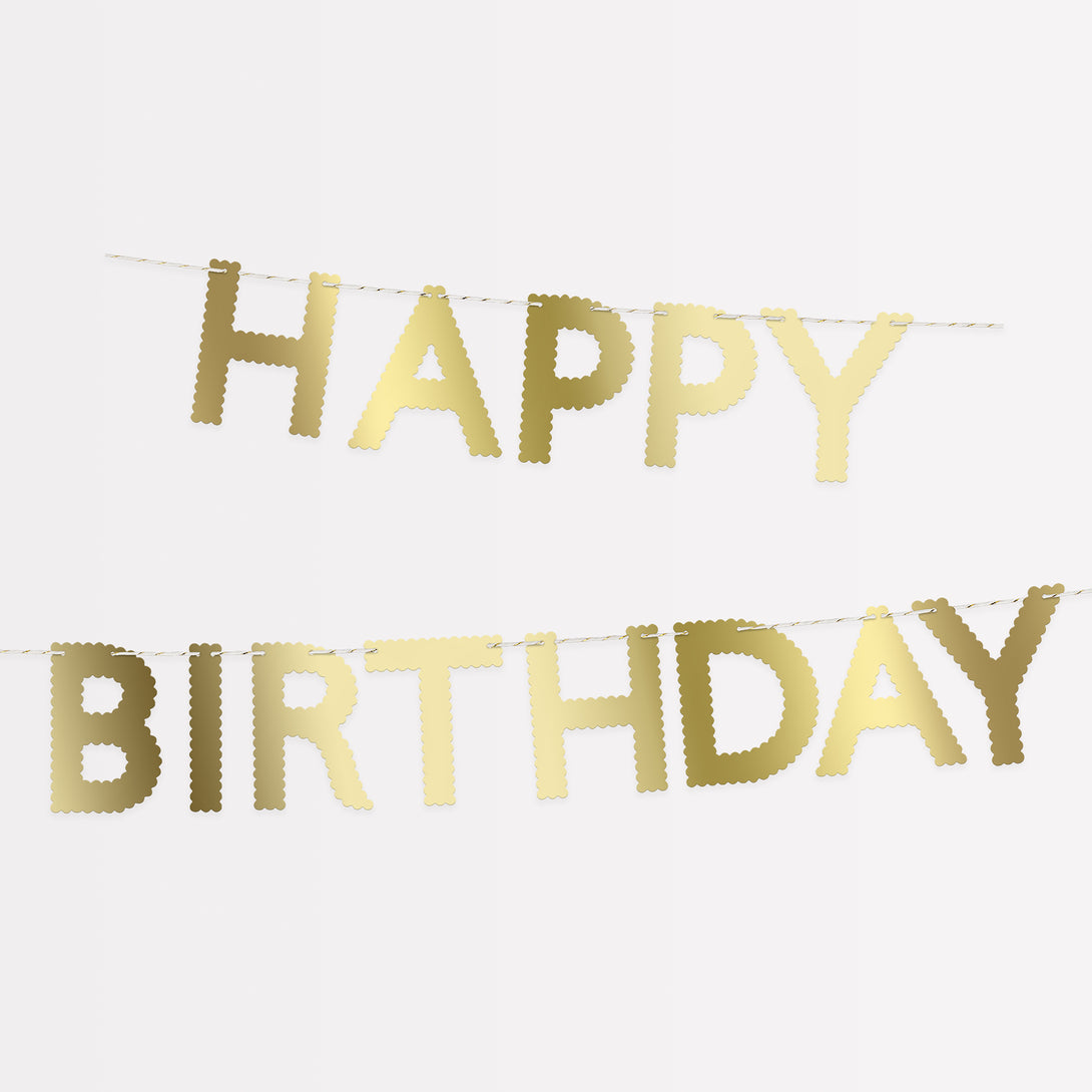 Our birthday garland, in shiny gold letters, is a great birthday party decoration to place on the party table, wall, mantel or doorway.