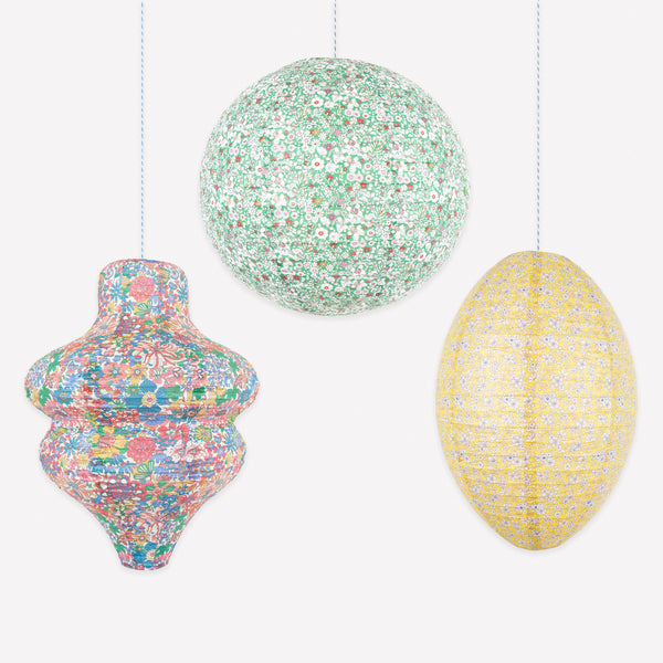 Our paper lantern set has a set of three, in a wavy, round and oval shape, each with a different Liberty floral print design, great for parties. Image1