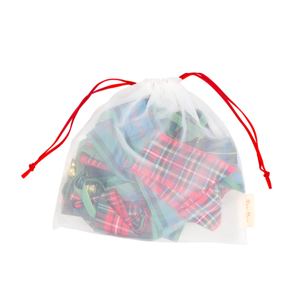 Our statement Christmas garland features large tartan bows with tinkling bells, perfect for hanging wherever you want seasonal sophistication. Image5