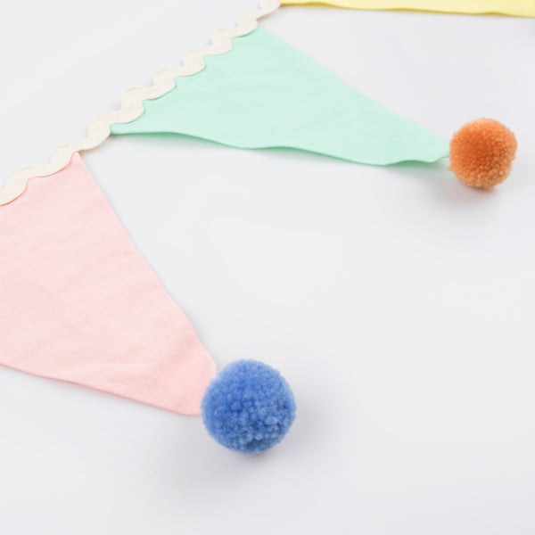 Add a pop of pastel colour to your party table or wall with our flag garland with pompoms. Image5