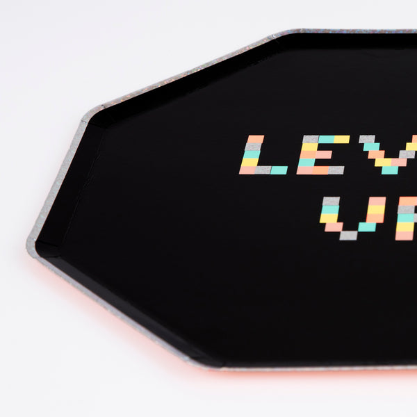 Our dinner plates are designed for a retro party for gamers, with lots of holographic silver foil, neon colours and an octagonal shape. Image3