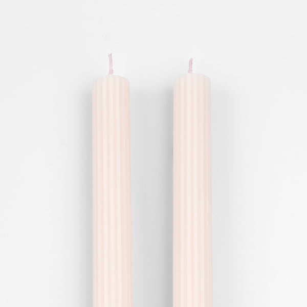 Decorate your table or mantel with our ridged long candles in a pretty peach pink shade. Image3