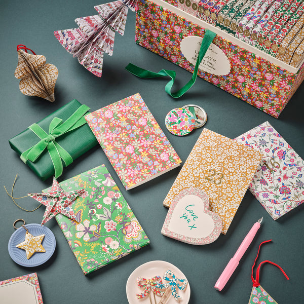 Our advent calendar is beautifully presented in a large Liberty print design box with 24 boxes inside containing stationery and decorations. Image2