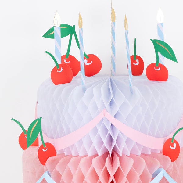 Our birthday cake decoration is a beautiful hanging decoration in the shape of a birthday cake, with honeycomb paper and paper candles. Image2