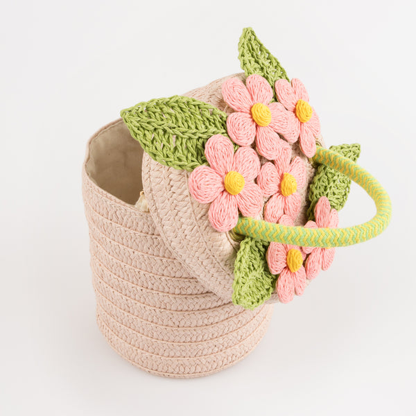 Our woven paper pink basket bag features paper flowers and leaves, a cord handle and a calico lining. Image5