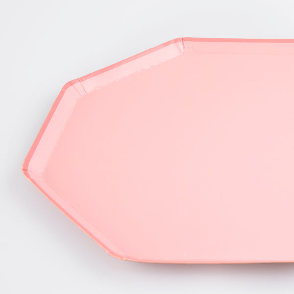 Our party plates are pink and have an octagonal shape, the perfect side plates for nibbles and treats. Image2