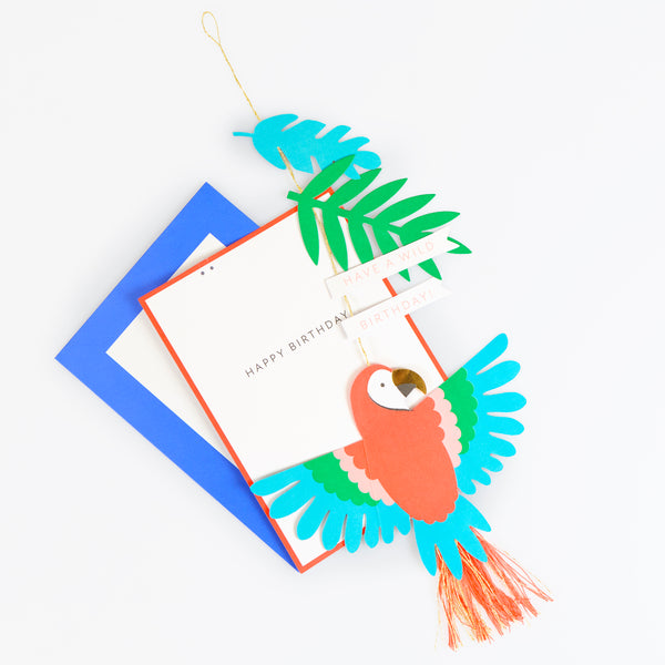 Our birthday card features a vibrant parrot with a tassel tail, with gold cord for hanging it to create a wonderful birthday decoration. Image3