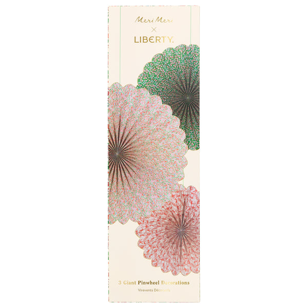 Our Christmas hanging decorations set features 3 paper Liberty floral print pinwheels with velvet hanging ribbons, perfect for an elegant look. Image7