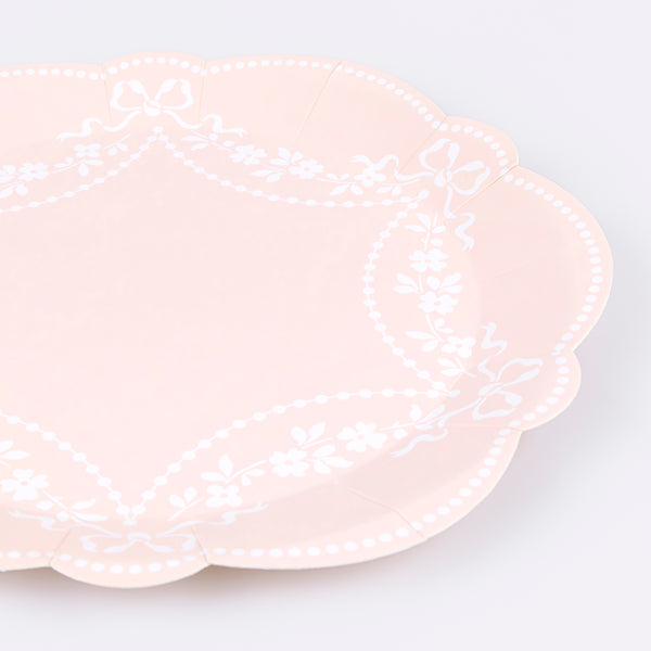Our paper plates, in pastel pink dinner plate size, feature an ornamental white Rococo based design, ideal for  baby showers and bridal showers. Image2