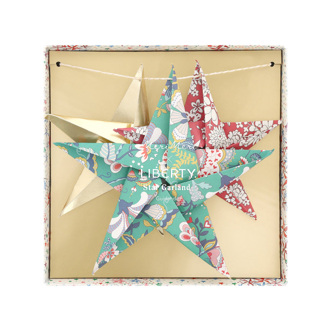 Let our star garland, designed with joyful Liberty star and floral prints and gold foil details, add an elegant touch to your Christmas décor. Image7