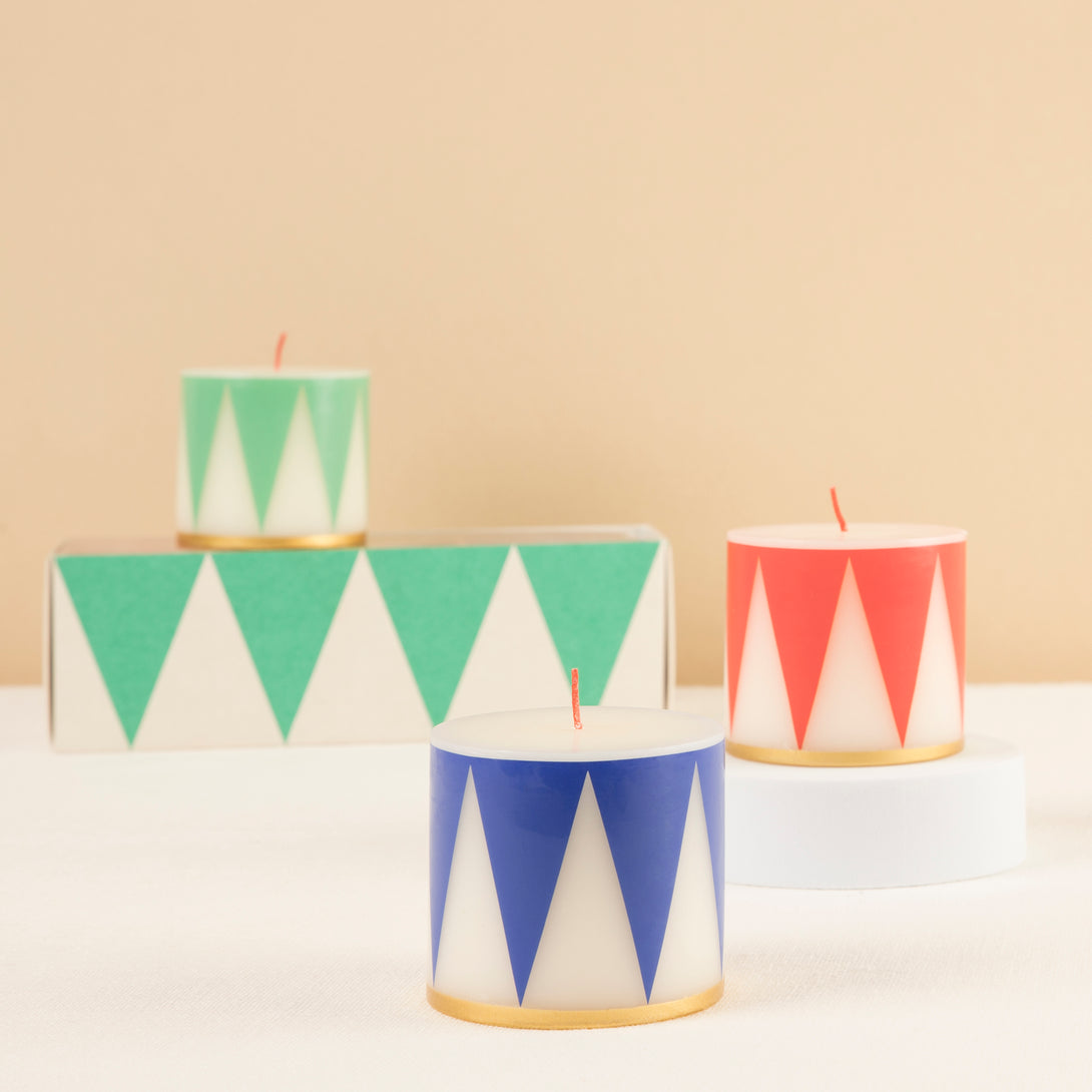 Our Christmas candle set of 3 candles have traditional Nutcracker designs of red, green and blue, with gold details and red wicks.