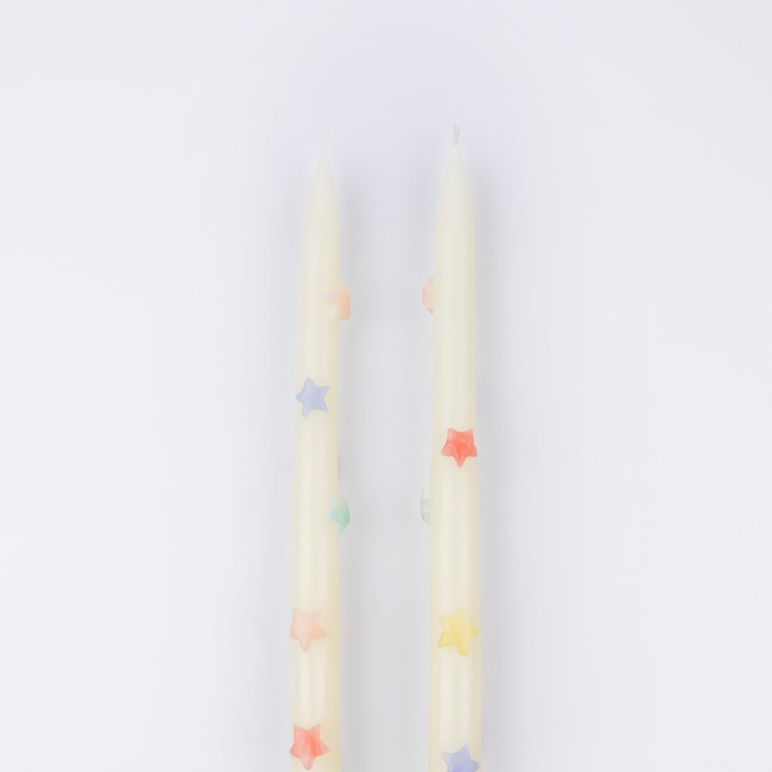 Our taper candles, with coloured stars, will look great as table candles or on placed on the mantel.